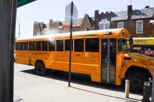 school bus with school trip kids came to art fun studio