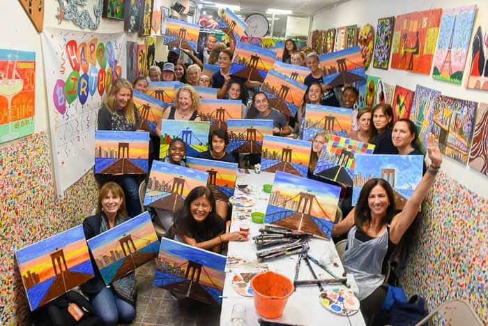 girls Cheer during sip and paint event